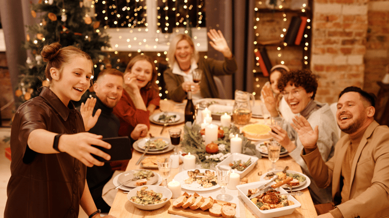 Friends gather together for the holiday while also celebrating with those remote