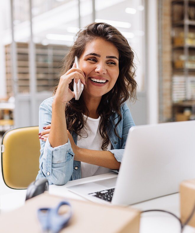 mage of a happy young businesswoman speaking on the phone showcasing efficient communication. Boom Collaboration Equipment enhances meetings by video-enabling conference rooms, allowing more work to get done. With quality cameras and speakerphones, Boom maximizes communication and collaboration across teams, increasing overall productivity. 