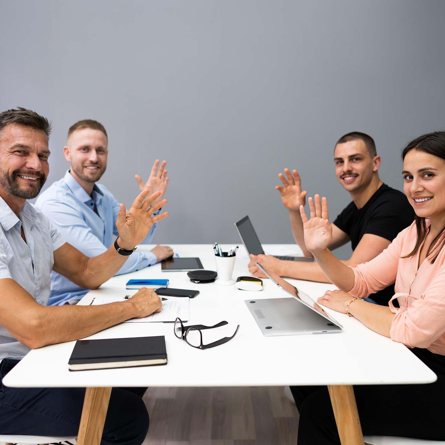 Boom Collaboration: Effortless Setup, Seamless Video Conferencing. Happy team collaborating in a conference room.