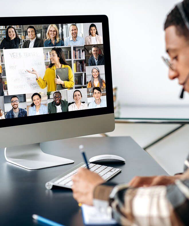 During an online training session, a man utilizes Boom equipment to facilitate remote learning, saving time and resources. 