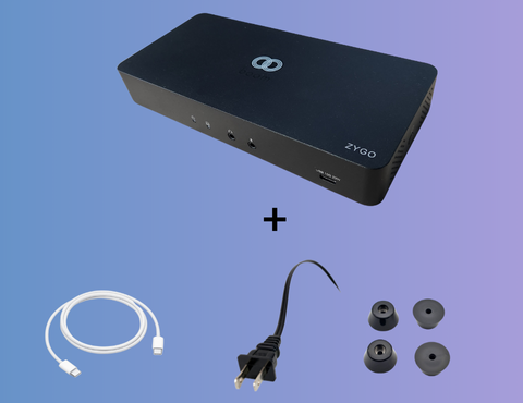 Boom ZYGO: a versatile multi-connectivity hub designed for seamless video conferencing and collaboration. It includes a USB-C to USB-C cable, universal power adapter, mounting kit, and four rubber feet for stability. Perfect for BYOD setups, offering easy plug-and-play functionality for any meeting environment.